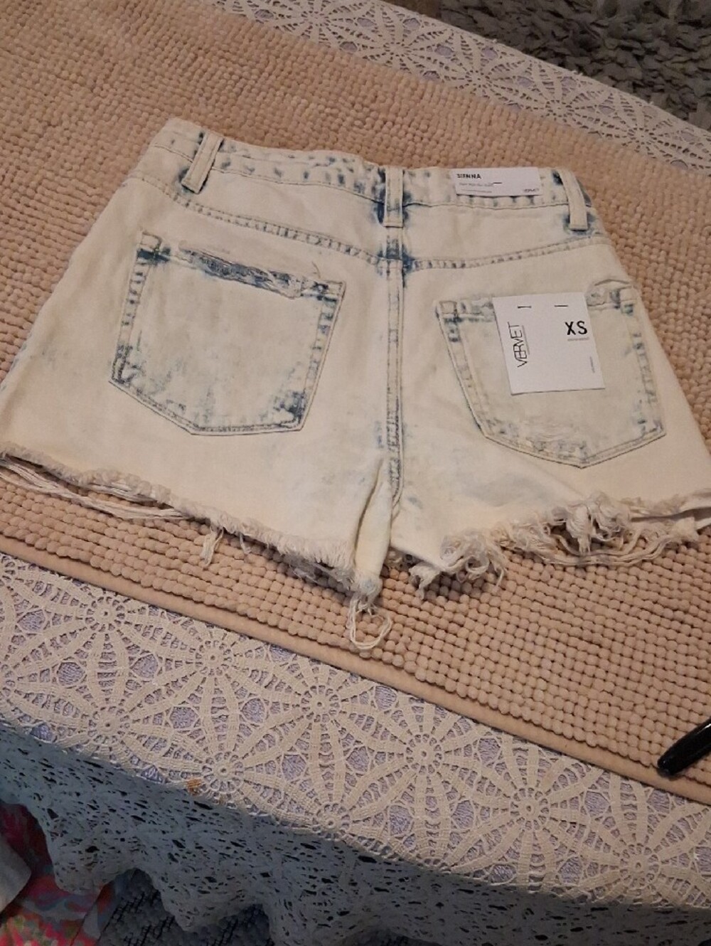 High-Rise Distressed White Denim Shorts with Button Fly - Picture 11 of 12